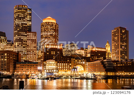 View of Boston downtown skyscrapers seen from Fan Pier Park on a cold cloudy winter night View of Boston downtown skyscrapers seen from Fan Pier Park on a cold cloudy winter night 123094176