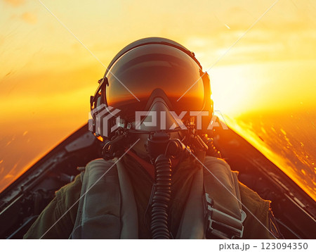 A pilot in a fighter jet cockpit flies above the clouds during a vibrant sunset, with the sun casting a golden glow on the aircraft and the sky. A pilot in a fighter jet cockpit flies above the clouds during a vibrant sunset, with the sun casting a golden glow on the aircraft and the sky. 123094350