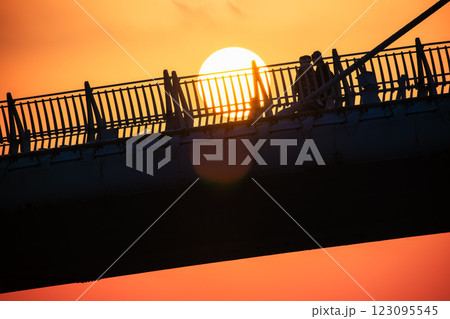 Sunset Over Lover's Bridge with Tourist Silhouettes, Tamsui, Taiwan. Sunset Over Lover's Bridge with Tourist Silhouettes, Tamsui, Taiwan. 123095545