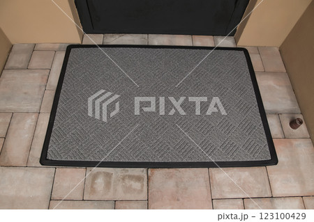 Door Mat Entryway Outdoor Mat Welcome Mats Entry Grey Mat. Brown floor tiles. Top View 123100429