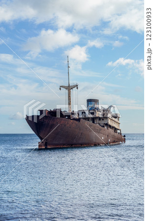 Abandoned Rusty Ship in Calm Ocean Waters Abandoned Rusty Ship in Calm Ocean Waters 123100933