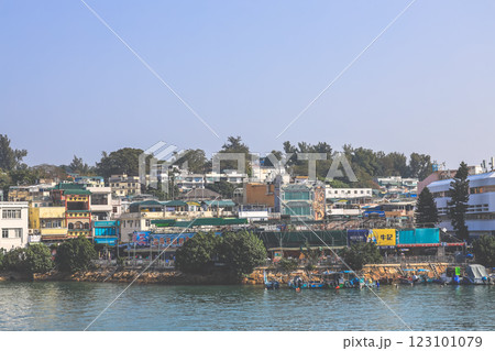 Dec 28 2024 Scenic Harbor View of a Colorful Coastal Town Under Blue Sky Dec 28 2024 Scenic Harbor View of a Colorful Coastal Town Under Blue Sky 123101079