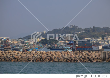 Dec 28 2024 Busy Harbor With Docked Fishing Boats and Scenic Mountain, Cheung Chau 123101085