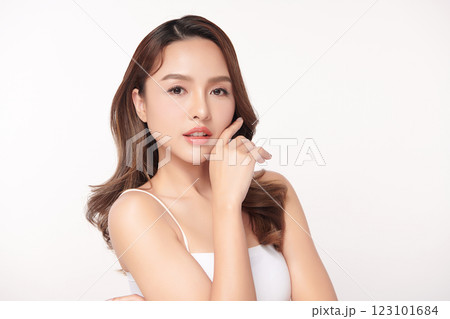 Beautiful young asian woman with clean fresh skin on white background, Face care, Facial treatment, Cosmetology, beauty and spa, Asian women portrait. Beautiful young asian woman with clean fresh skin on white background, Face care, Facial treatment, Cosmetology, beauty and spa, Asian women portrait. 123101684