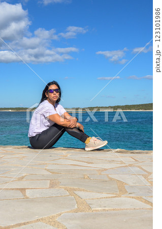 Latin woman with sunglasses enjoying the sea in Mallorca. Latin woman with sunglasses enjoying the sea in Mallorca. 123101986