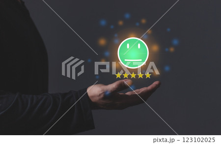 Young Man hand holding emoji five star to review and give 5 stars Young Man hand holding emoji five star to review and give 5 stars 123102025