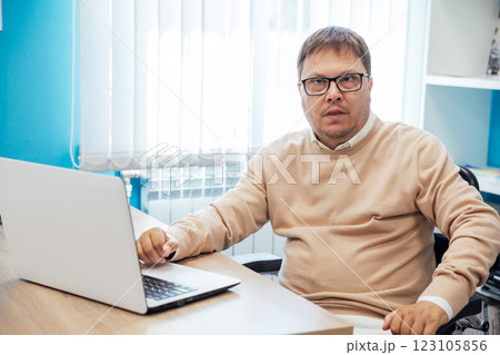Business man at desk with laptop at work in office Business man at desk with laptop at work in office 123105856