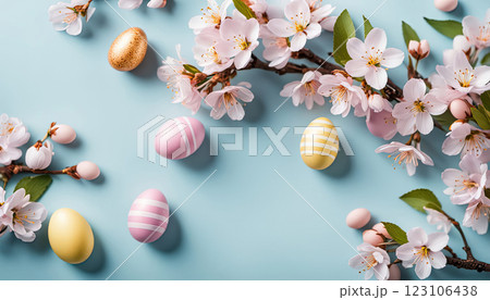 Easter light yellow background anchors a delicate frame of soft pink cherry blossoms and pastel Easter eggs, 123106438