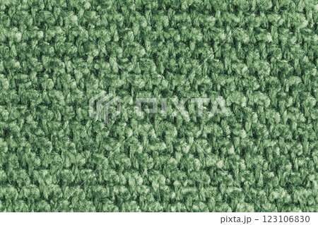 Texture of green jacquard fabric of rough weave structure close up, macro, background 123106830