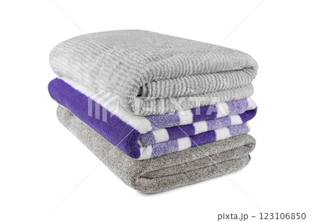 Soft fluffy striped grey and purple bath towels folded in stack isolated on white background Soft fluffy striped grey and purple bath towels folded in stack isolated on white background 123106850