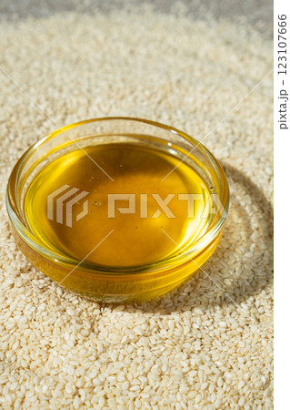 Unrefined cold pressed sesame oil in a glass bowl. Unrefined cold pressed sesame oil in a glass bowl. 123107666