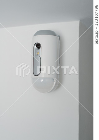 motion detector equipped with a camera indoors motion detector equipped with a camera indoors 123107796