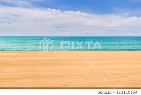Empty wooden table with beautiful beach, sea and sky in the background. Empty wooden table with beautiful beach, sea and sky in the background. 123110154