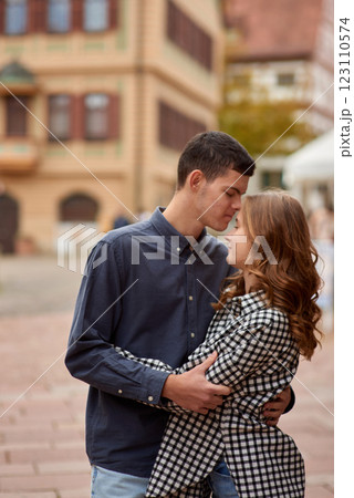 Young Cute Female Hugs Boyfriend. In Autumn Outdoor. Lovers Walking in Park. Attractive Funny Couple. Lovestory in Forest. Man and Woman. Cute Lovers in the Park. Family Concept. Happy Couple. 123110574