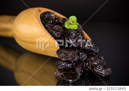 Natural dried plums close-up in macro photography 123111643