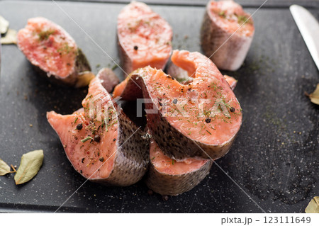 Natural piece of salmon with spices and herbs Natural piece of salmon with spices and herbs 123111649