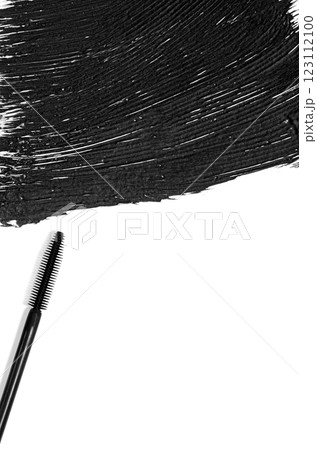 The texture of black mascara and an eyelash brush. Copy space The texture of black mascara and an eyelash brush. Copy space 123112100