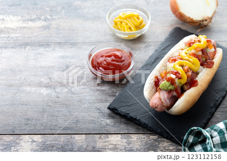 Sonoran hot dog. Traditional Mexican hot dog on wooden table 123112158