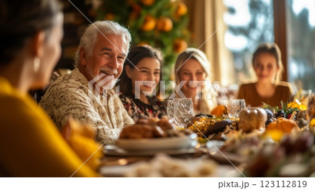 A joyful family gathering around a beautifully set dinner table. Laughter and warmth fill the air. Cherished moments spent together in celebration. Generative AI 123112819
