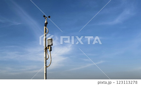 Win measuring device at a windmill power generator farm. 123113278