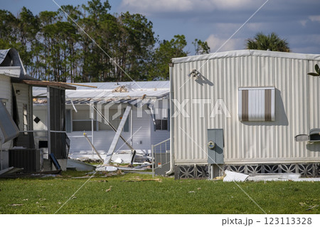 Property damage from strong hurricane winds. Mobile homes in Florida residential area with destroyed rooftops. Consequences of natural disaster 123113328