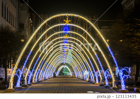 Night view of New Year or Christmas decorative arches with bright lights during winter holidays in Ivano-Frankivsk city, Ukraine. 123113435
