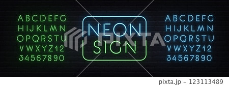 Neon Duo green and blue alphabet on brick wall background. Template with glow letters for light text sign. 123113489