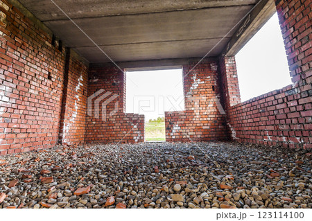 Interior of an old building under construction. Orange brick walls in a new house. 123114100