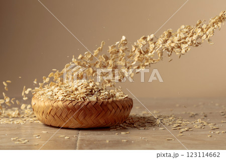 Oat flakes in motion on a beige background. Oat flakes in motion on a beige background. 123114662