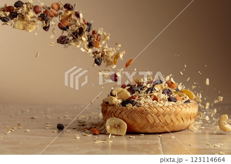 Muesli in motion on a beige background. Muesli in motion on a beige background. 123114664