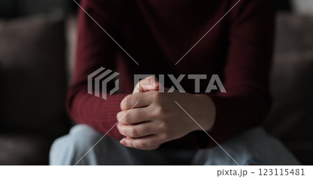 Young woman suffering from depression. Woman hands, fidget and pray, signaling mental battle. Emotional relationship and marriage crisis. 123115481