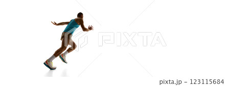 Banner. Sprinter accelerating towards finish, strong stride and engaged muscles displaying full speed against white studio background. Copy space. 123115684
