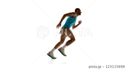 Runner accelerating forward, dynamic posture and strong physique emphasizing movement against white studio background. Runner accelerating forward, dynamic posture and strong physique emphasizing movement against white studio background. 123115699