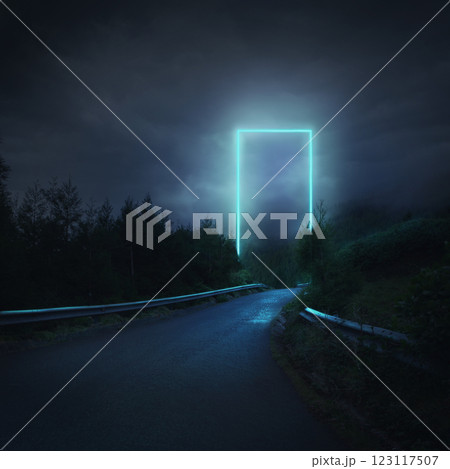 Composite image. Bright rectangular portal standing in misty forest at night, illuminating wet road leading into unknown. 123117507