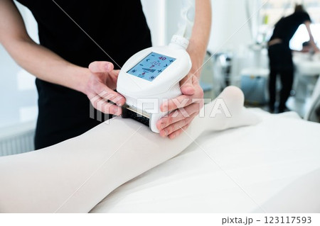 Leg treatment session using advanced technology at a spa facility Leg treatment session using advanced technology at a spa facility 123117593