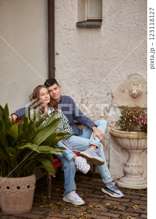 Young Cute Female Hugs Boyfriend. In Autumn Outdoor. Lovers Walking in Park. Attractive Funny Couple. Lovestory in Forest. Man and Woman. Cute Lovers in the Park. Family Concept. Happy Couple. 123118127