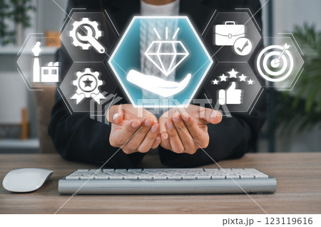 Businessman presenting digital icons symbolizing value, success, and achievement in a modern business environment. Businessman presenting digital icons symbolizing value, success, and achievement in a modern business environment. 123119616
