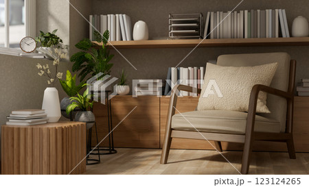 A wooden armchair and a table with decorative items in front of the build in wooden shelf. 123124265