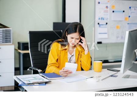 Asian business woman is stressed, bored, and overthinking from working 123124543