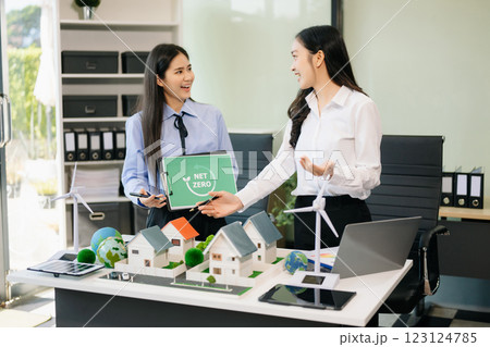 Business team people planning hand using laptop for working technology and business Net zero 123124785