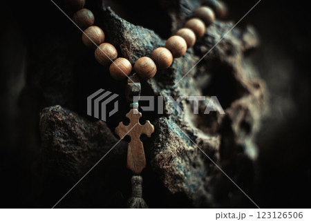 Rosary with rhe cross and beads. Symbol of prayer and religion, christianity Rosary with rhe cross and beads. Symbol of prayer and religion, christianity 123126506