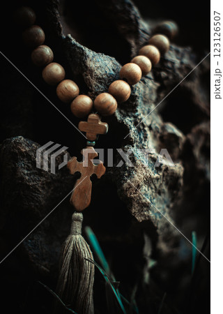 Rosary with rhe cross and beads. Symbol of prayer and religion, christianity Rosary with rhe cross and beads. Symbol of prayer and religion, christianity 123126507