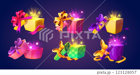 Open gift boxes set with glowing magical light 123128057