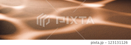 Soft golden sand with abstract light reflections, wave patterns natural background or product placement in warm earthy tones for design and advertising project Soft golden sand with abstract light reflections, wave patterns natural background or product placement in warm earthy tones for design and advertising project 123131126
