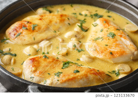 Chicken Diane features brandy, dijon mustard, and heavy cream closeup in the skillet. Horizontal 123133670