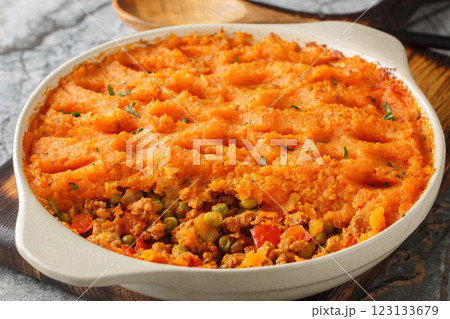 Low calorie Sweet Potato Shepherd's Pie with Turkey and Vegetables close-up in baking dish. Horizontal Low calorie Sweet Potato Shepherd's Pie with Turkey and Vegetables close-up in baking dish. Horizontal 123133679