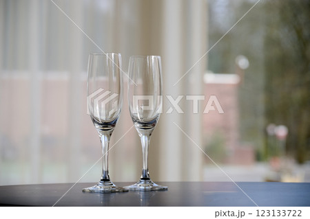 Two empty glasses of Champagne on table after party 123133722