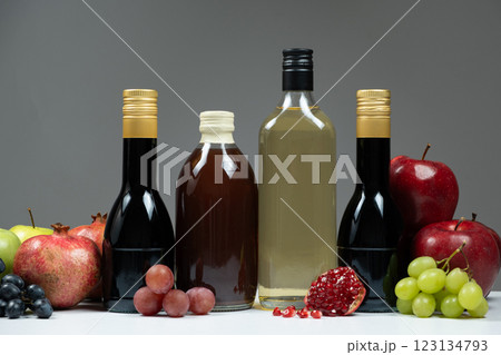 Different types of vinegar, balsamic, pomegranate and apple vinegars in bottles 123134793