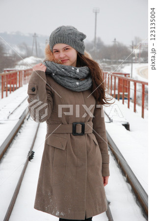 Winter fashion on snowy railroad bridge 123135004