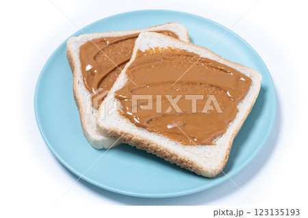 Bread toast with peanut butter cream isolated on white background Bread toast with peanut butter cream isolated on white background 123135193
